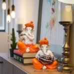 Xtore Musical Ganesha Pair for Home Decor Handicraft Resin| Brings Prosperity - (Orange and White, Pack of 2)(Resin) - Fast Shipping to USA & Canada - Image 4