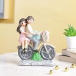 CraftVatika Love Couple on Cycle Statue Showpiece for Home Decor, Cycle Couple Sculpture Figurine Gift for Home Decor, Table Top, Couple, (4.9x1.4x6 Inches) - Fast Shipping to USA & Canada