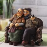 CraftVatika Dada Dadi Romantic Couple Miniatures Grand Parents on Sofa Statue Showpiece for Home Decor - Best Gift for Love, Valentine, Retirement Party, Wedding Anniversary, Multicolor, 14 x 8.9 cm - Fast Shipping to USA & Canada