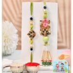 CraftVatika Designer Rakhi Set for Brother Bhaiya Bhabhi | Peacock Rakhi for Bhaiya Bhabhi Raksha Bandhan Couple Set of 2 with Fridge Magnet Gift, Rakshabandhan Greeting Card, Tilak Set,Home Decor - Fast Shipping to USA & Canada